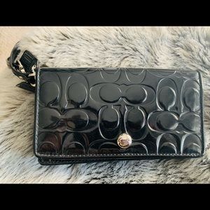 Coach NWT, paten leather wrist bag .